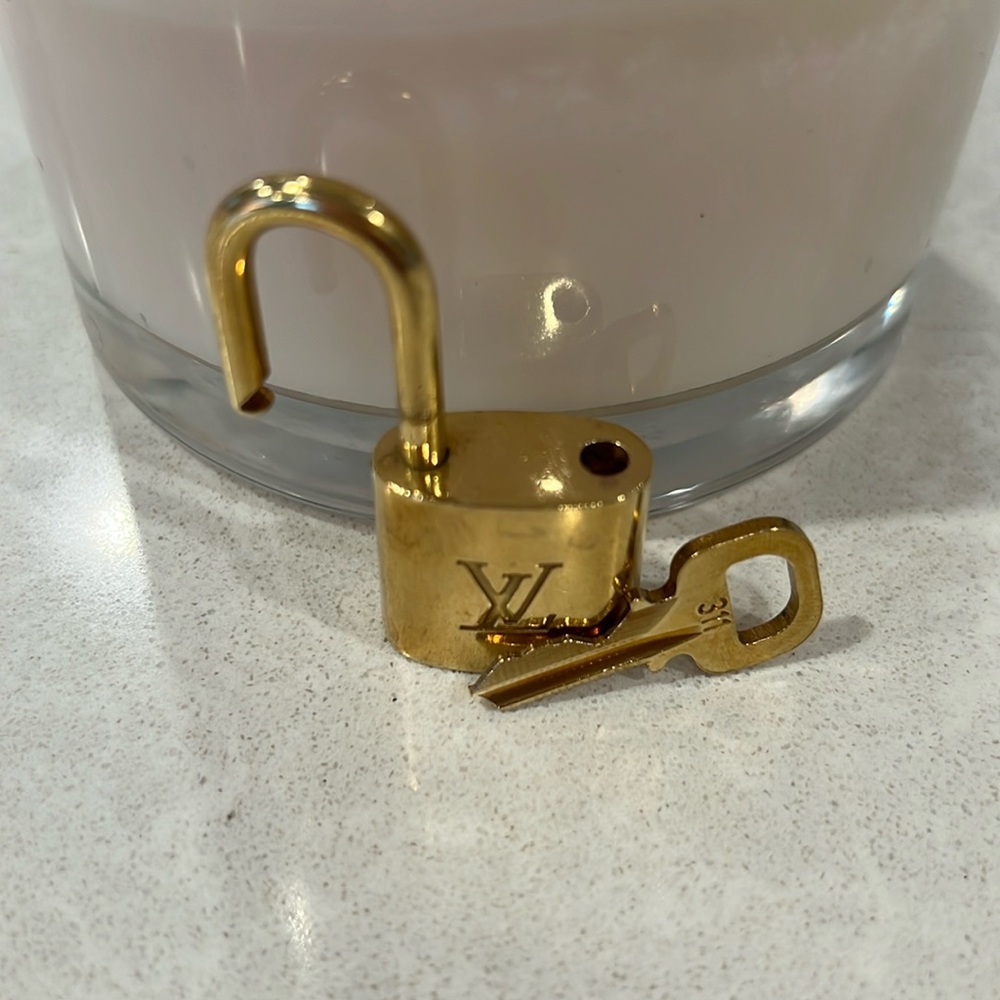 Louis Vuitton gold lock and key. Authentic